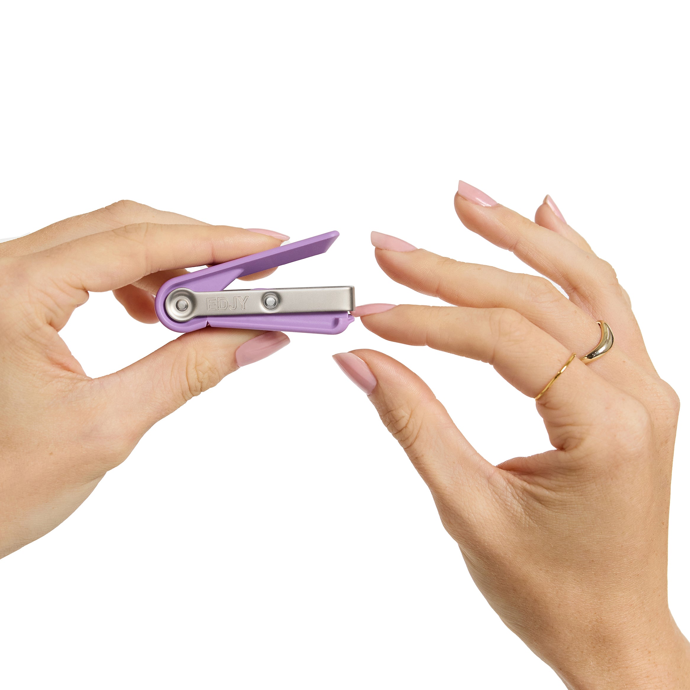 Woman cutting her fingernail with and EDJY fingernail cutter