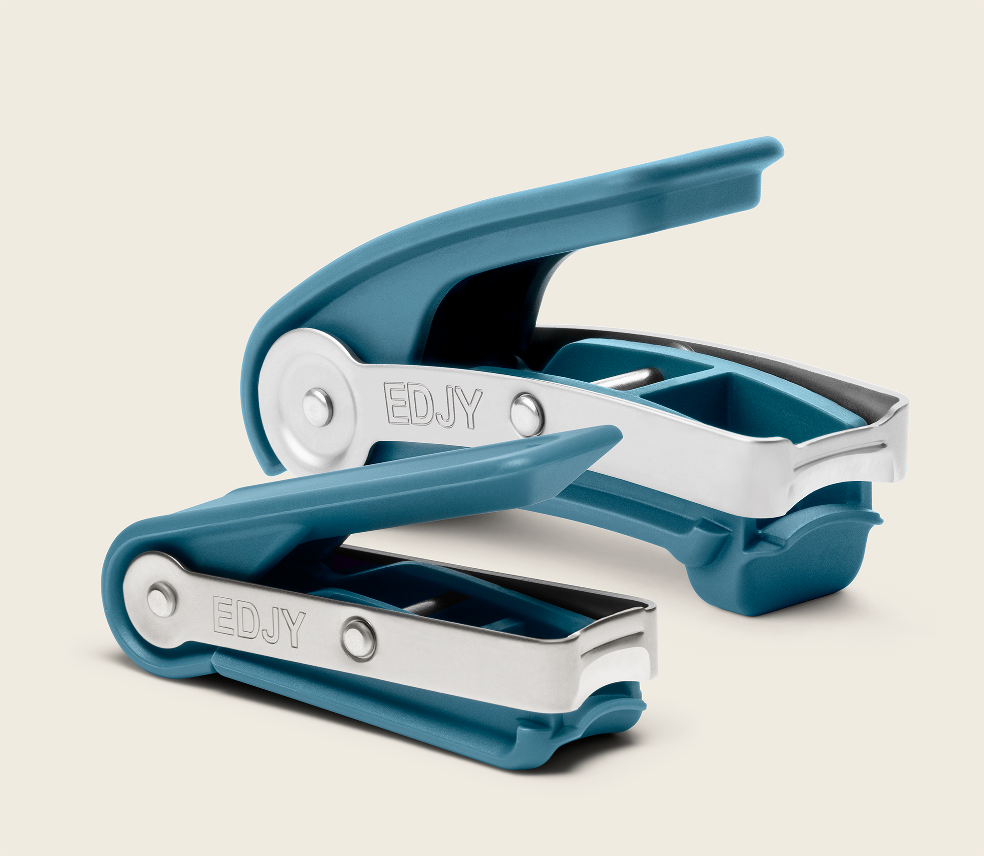 Teal EDJY fingernail and toenail cutters side-by-side, showcasing their ergonomic design and difference in size.